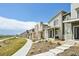 Street view of the new construction homes showcasing their modern designs, landscaping, and inviting walkways at 5278 Warrior St, Frederick, CO 80504