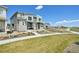 View of a modern two-story home with a well-maintained lawn and walkway in a picturesque neighborhood at 5278 Warrior St, Frederick, CO 80504