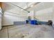 Spacious and clean garage featuring sealed concrete floors and ample storage space at 5278 Warrior St, Frederick, CO 80504