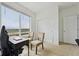 Well-lit home office with a large window, modern furnishings, and neutral decor at 5278 Warrior St, Frederick, CO 80504