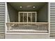 View of a cozy outdoor patio with a table, and sliding glass doors leading into the house at 5278 Warrior St, Frederick, CO 80504