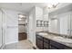 Bathroom with double sinks, a shower, and a walk-in closet at 6104 Black Mesa Rd, Frederick, CO 80516