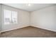 Simple bedroom with carpet and a window with blinds at 6104 Black Mesa Rd, Frederick, CO 80516