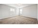 Well-lit bedroom with neutral walls and carpet flooring at 6104 Black Mesa Rd, Frederick, CO 80516