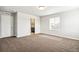 Bright bedroom with carpet and en-suite bathroom access at 6104 Black Mesa Rd, Frederick, CO 80516