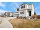 Two-story house with gray trim, two-car garage, and landscaping at 6104 Black Mesa Rd, Frederick, CO 80516