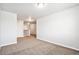 Upstairs hallway with neutral walls and carpet at 6104 Black Mesa Rd, Frederick, CO 80516