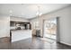 Kitchen with island, dark cabinets, and stainless steel appliances at 6104 Black Mesa Rd, Frederick, CO 80516