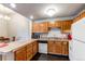 Well-equipped kitchen with abundant cabinet space and modern appliances, adjacent to dining area at 2280 S Oswego Way # 303, Aurora, CO 80014