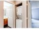 Convenient laundry closet with stacked washer and dryer, located near the bathroom and bedroom at 2280 S Oswego Way # 303, Aurora, CO 80014
