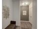 Charming entry hallway with stylish decor and lighting at 8475 E 36Th Ave # 331, Denver, CO 80238