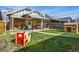 Spacious backyard with a patio, green grass, and a small playground at 3415 N Vine St, Denver, CO 80205