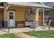 Inviting backyard patio with comfortable seating, string lights, and a brick path leading to the lawn at 3415 N Vine St, Denver, CO 80205