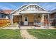 Brick house exterior with a covered patio and outdoor dining area at 3415 N Vine St, Denver, CO 80205
