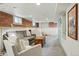 Finished basement featuring exposed brick, carpeted floors, and recessed lighting at 3415 N Vine St, Denver, CO 80205