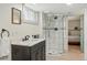 Basement bathroom featuring a modern shower stall and neutral vanity at 3415 N Vine St, Denver, CO 80205