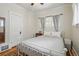 Bedroom with hardwood floors, neutral walls, and natural light at 3415 N Vine St, Denver, CO 80205
