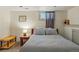 Finished basement bedroom with a small window and neutral decor at 3415 N Vine St, Denver, CO 80205