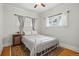 Cozy bedroom with hardwood floors, vintage rug, and a comfortable bed at 3415 N Vine St, Denver, CO 80205