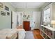 Cozy bedroom features a built-in bookcase, hardwood floors, and a neutral color palette at 3415 N Vine St, Denver, CO 80205