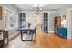 Open dining area featuring built-in cabinets, hardwood floors, and natural light at 3415 N Vine St, Denver, CO 80205
