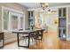 Dining room showcasing hardwood floors, built-in cabinets, and decorative lighting at 3415 N Vine St, Denver, CO 80205