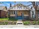Charming brick home with a welcoming front porch and manicured landscaping at 3415 N Vine St, Denver, CO 80205