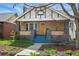 Inviting home exterior featuring a front porch, colorful front door, and lush landscaping at 3415 N Vine St, Denver, CO 80205