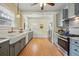 Spacious kitchen with farmhouse sink, stainless steel appliances, and an open layout at 3415 N Vine St, Denver, CO 80205