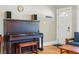 Cozy living room featuring a vintage piano and bright natural light at 3415 N Vine St, Denver, CO 80205