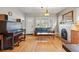 Comfortable living room featuring a vintage piano and decorative fireplace at 3415 N Vine St, Denver, CO 80205