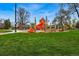 Community playground featuring slides, climbing structures, and a safe, green play area at 3415 N Vine St, Denver, CO 80205