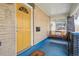 Welcoming front porch with a cozy porch swing and inviting yellow door at 3415 N Vine St, Denver, CO 80205