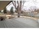 Back deck featuring wood bench seating and backyard views at 6847 S Hill St, Littleton, CO 80120