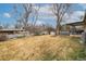 Large, open backyard featuring several mature trees at 6847 S Hill St, Littleton, CO 80120