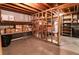 Unfinished basement space with exposed wood beams and utilitarian shelving at 6847 S Hill St, Littleton, CO 80120