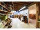 Basement with paneled walls, storage shelves, work counter, and vintage cabinets at 6847 S Hill St, Littleton, CO 80120