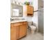 Well-lit bathroom features a vanity with a granite countertop and a tiled shower with a glass door at 6847 S Hill St, Littleton, CO 80120