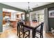 Open dining area connects to the kitchen, featuring hardwood floors and stylish table at 6847 S Hill St, Littleton, CO 80120