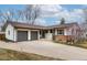 Ranch-style house with an attached two-car garage and large driveway at 6847 S Hill St, Littleton, CO 80120
