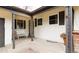 Inviting front porch features neutral siding, decorative columns, and seating area for relaxing at 6847 S Hill St, Littleton, CO 80120