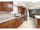 Stylish kitchen with stainless steel appliances, granite countertops and access to the dining room at 6847 S Hill St, Littleton, CO 80120