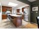 Well-lit kitchen features granite countertops, stainless steel appliances and stylish tile flooring at 6847 S Hill St, Littleton, CO 80120