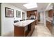 Spacious kitchen island with granite countertop, drawers, and stylish tile flooring and a microwave at 6847 S Hill St, Littleton, CO 80120