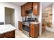 Close-up on oven and stove featuring stainless steel appliances, granite countertops, and stylish tile at 6847 S Hill St, Littleton, CO 80120