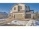 Charming two-story home with a two car garage, covered porch, and neutral siding against a blue sky at 42367 Glen Abbey Dr, Elizabeth, CO 80107