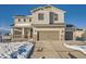 Charming two-story home with a two car garage, covered porch, and neutral siding against a blue sky at 42367 Glen Abbey Dr, Elizabeth, CO 80107