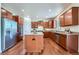 A spacious kitchen with wood cabinets, stainless steel appliances, and granite countertops at 42367 Glen Abbey Dr, Elizabeth, CO 80107