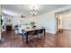 Open living and dining room area with hardwood floors and fireplace at 42367 Glen Abbey Dr, Elizabeth, CO 80107