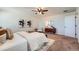 A bright main bedroom with a ceiling fan, neutral walls and carpet at 42367 Glen Abbey Dr, Elizabeth, CO 80107